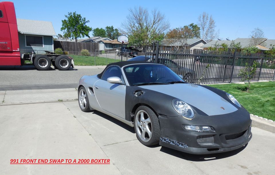 Porsche Boxster with a 991 front end fitted, in primer before paint